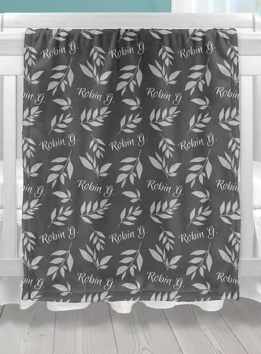 Custom Baby Throw Blanket with Name and Leaves on a Gray Background