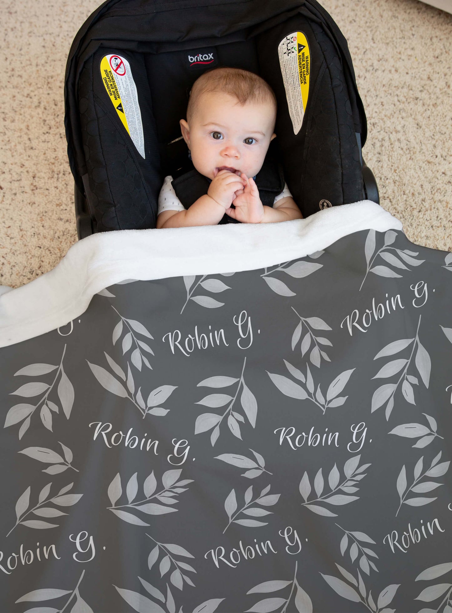 Custom Baby Throw Blanket with Name and Leaves on a Gray Background
